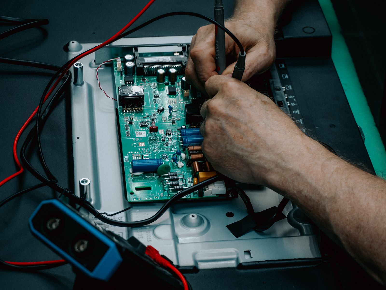 Close-up of a TV circuit board during backlight repair — TVCare Mumbai backlight repair service in Mira Road